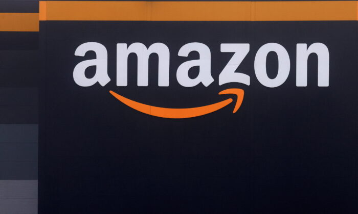 The logo of Amazon at the company logistics center in Bretigny-sur-Orge near Paris on Dec. 7, 2021. (Gonzalo Fuentes/Reuters)