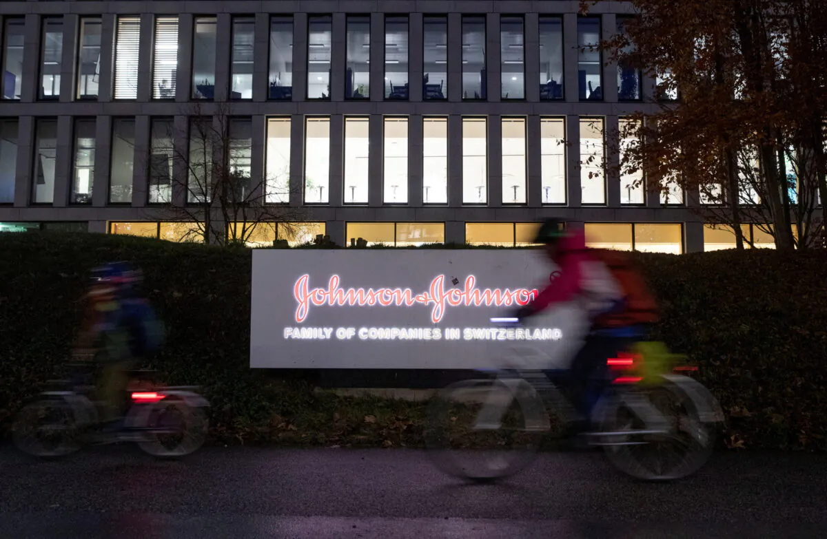 The logo of healthcare company Johnson & Johnson in front of an office building in Zug, Switzerland, on Dec. 1, 2021. (Arnd Wiegmann/Reuters)