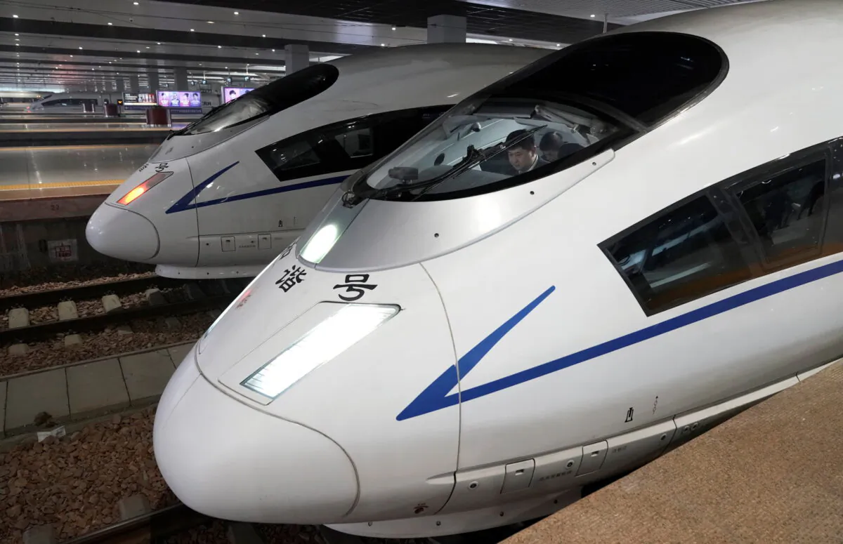 An employee in the cab of a train inside Zhengzhou East Railway Station during the annual travel rush ahead of the Chinese Lunar New Year, in Zhengzhou, Henan province, China, on Jan. 13, 2020. (Jason Lee/Reuters)