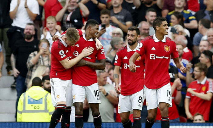 Manchester United's Marcus Rashford celebrates scoring their third goal with Scott McTominay, Bruno Fernandes and Raphael Varane during the English Premier League football match between Manchester United and Arsenal at Old Trafford in Manchester, north west England, on Sept. 4, 2022. (Craig Brough/Reuters)