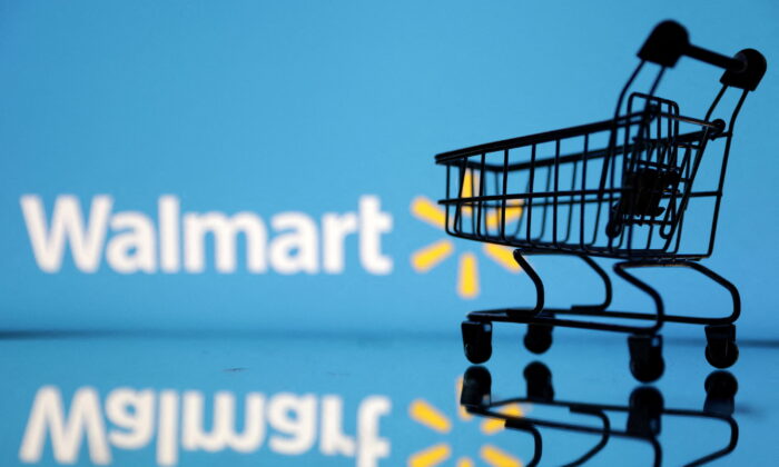 Shopping trolley in front of Walmart logo in a photo illustration on July 24, 2022. (Dado Ruvic/Reuters)