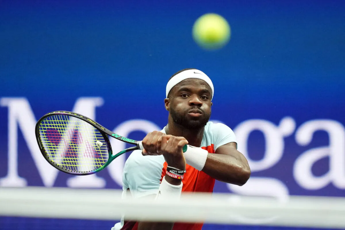 Frances Tiafoe of the United States hits to Andrey Rublev of Russia on day ten of the 2022 U.S. Open tennis tournament at USTA Billie Jean King Tennis Center in New York on Sept. 7. 2022. (Danielle Parhizkaran/USA TODAY Sports via Reuters)