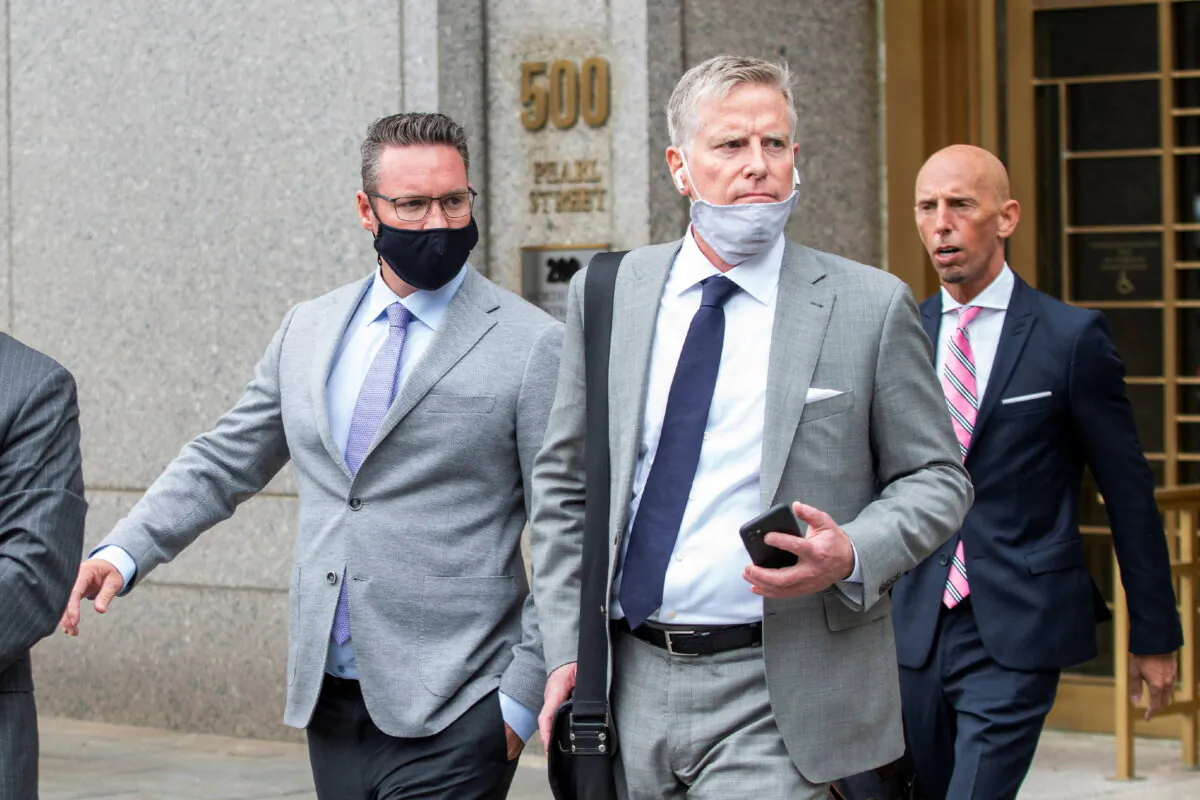 Trevor Milton (L), founder and former-CEO of Nikola Corp., exits the Manhattan Federal Courthouse following an appearance in New York on July 29, 2021. (Eduardo Munoz/Reuters)