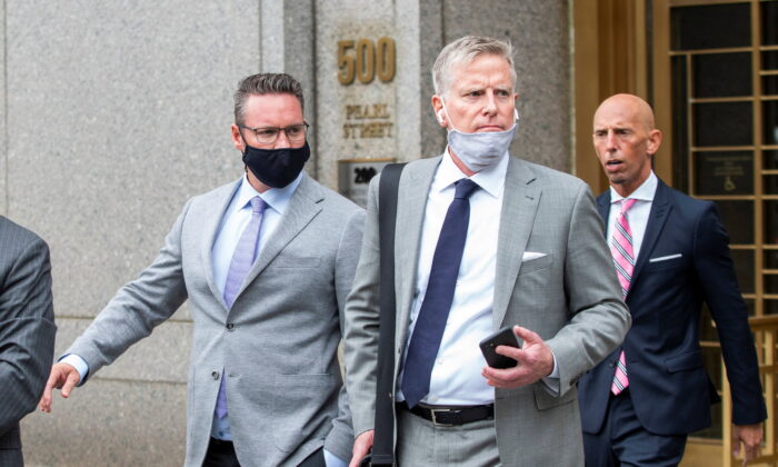 Trevor Milton (L), founder and former-CEO of Nikola Corp., exits the Manhattan Federal Courthouse following an appearance in New York on July 29, 2021. (Eduardo Munoz/Reuters)