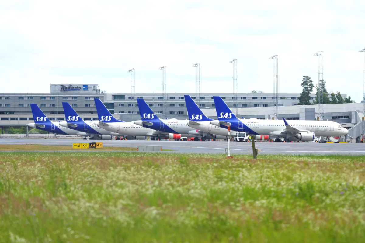Scandinavian Airlines (SAS) airplanes are parked at the Oslo Airport Gardermoen in Norway on July 4, 2022. (Beate Oma Dahle/NTB via Reuters)