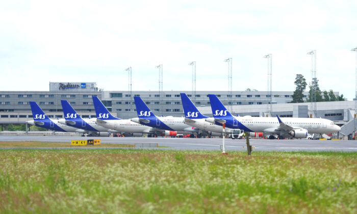 Scandinavian Airlines (SAS) airplanes are parked at the Oslo Airport Gardermoen in Norway on July 4, 2022. (Beate Oma Dahle/NTB via Reuters)