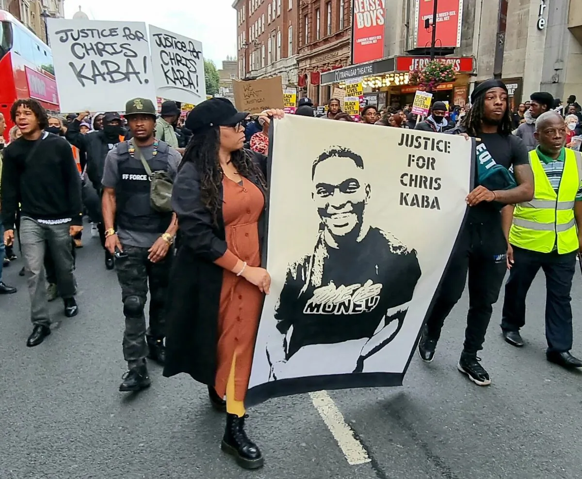 Handout photo taken with permission from the Twitter feed of @LeftUnityParty of demonstrators marching in protest of the police killing of Chris Kaba, in London on Sept. 10, 2022. (Left Unity via PA Media)

