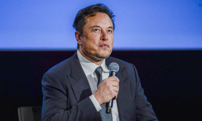 Tesla CEO Elon Musk looks up as he addresses guests at the Offshore Northern Seas 2022 (ONS) meeting in Stavanger, Norway, on Aug. 29, 2022. (Carina Johansen/NTB/AFP via Getty Images)