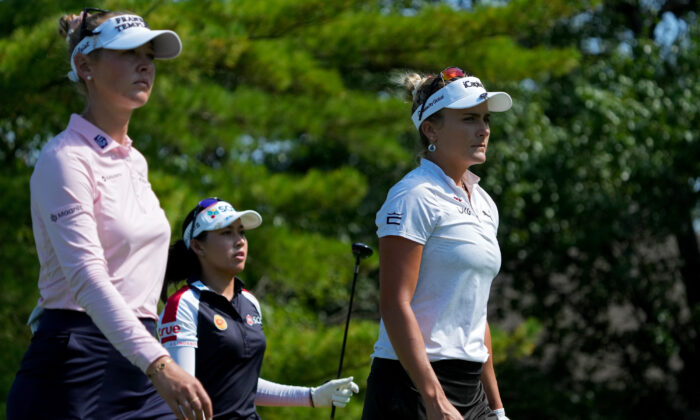 (L-R) Jessica Korda of the United States, Atthaya Thitikul of Thailand, and Lexi Thompson of the United States walk off the fifth tee during the second round of the Kroger Queen City Championship presented by P&G at Kenwood Country Club in Cincinnati, on Sept. 9, 2022. (Dylan Buell/Getty Images)