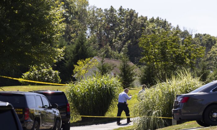 Law enforcement gather at the scene of a shooting in Elk Mills, Md., on Sept. 9, 2022. (Ryan Collerd/AP Photo)