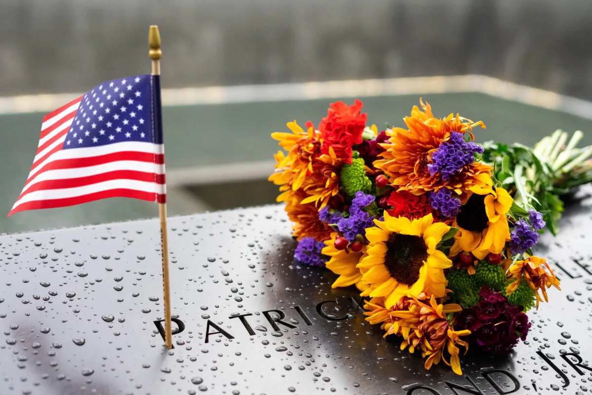 People pay respects at the National September 11 Memorial Museum in New York on Sept. 11, 2022. (Chung I Ho/The Epoch Times)