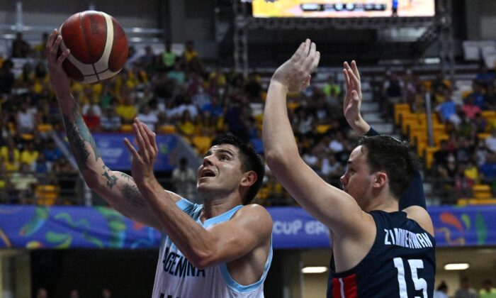 Argentina's Gabriel Deck (L) and U.S.'s Stephen Zimmerman battle for a ball during the FIBA Men's AmeriCup semifinal game in Recife, Pernambuco state, Brazil, on Sept. 10, 2022. (Nelson Almeida/AFP via Getty Images)