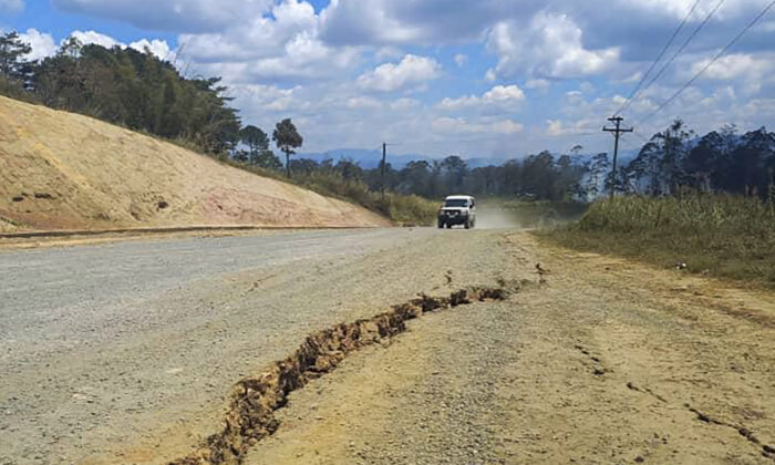 A large crack on a highway near the town of Kainantu, following a 7.6-magnitude earthquake in northeastern Papua New Guinea, on Sept. 11, 2022. (Renagi Ravu via AP)