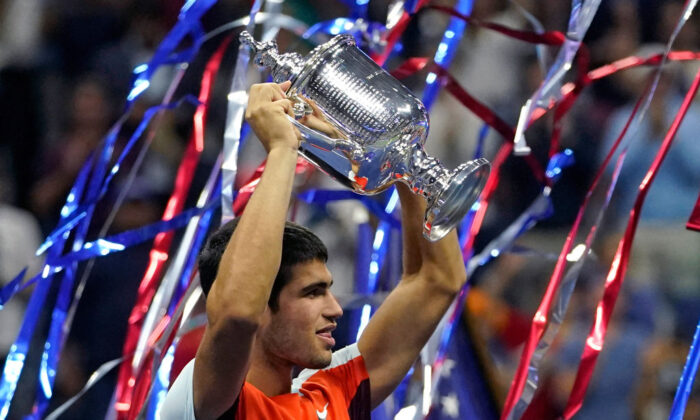 Spain's Carlos Alcaraz celebrates with the trophy after winning against Norway's Casper Ruud during their 2022 US Open Tennis tournament men's singles final match at the USTA Billie Jean King National Tennis Center in New York, on Sept. 11, 2022. (Timothy A. Clary/AFP via Getty Images)