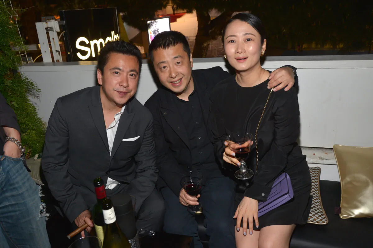 (L-R) James Wang, chief executive officer of Huayi Brothers Media Corp., director Zhangke Jia, and Zhao Tao attend the Huayi Brothers At 20 Party during the 67th Annual Cannes Film Festival at L'Observatoire Francesco Smalto on May 18, 2014 in Cannes, France. (Michael Buckner/Getty Images for Variety)