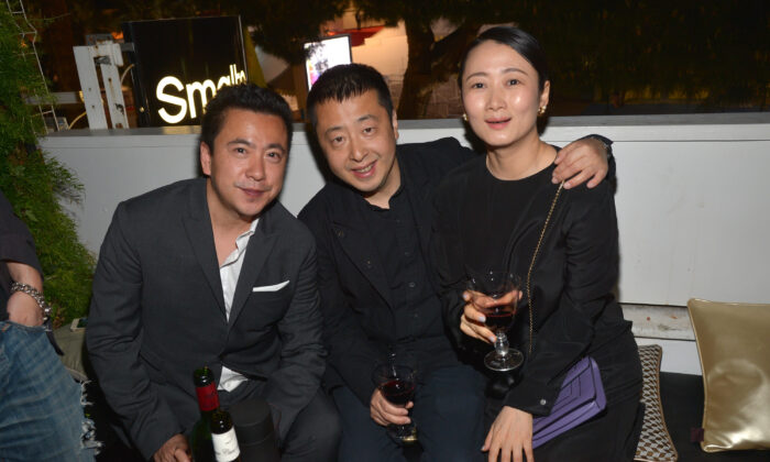 (L-R) James Wang, chief executive officer of Huayi Brothers Media Corp., director Zhangke Jia, and Zhao Tao attend the Huayi Brothers At 20 Party  during the 67th Annual Cannes Film Festival at L'Observatoire Francesco Smalto on May 18, 2014 in Cannes, France.  (Michael Buckner/Getty Images for Variety)