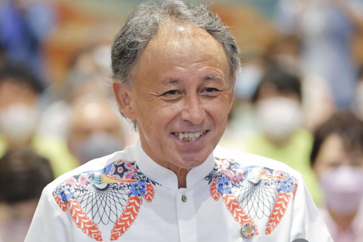 Okinawa Gov. Denny Tamaki, who is backed by opposition parties, speaks to media after the gubernatorial election, in Naha, Okinawa prefecture, Sunday, Sept. 11, 2022. Tamaki, the incumbent governor who opposes an ongoing U.S. Marine base relocation forced by Japan's central government and calls for a further reduction of American troops on the southern island, secured his reelection on Sunday despite concerns of escalating tensions between China and nearby Taiwan.(Kyodo News via AP)