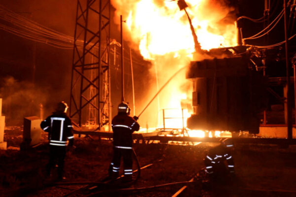 Firefighters at the site of a Kharkov thermal power plant damaged by a Russian missile attack