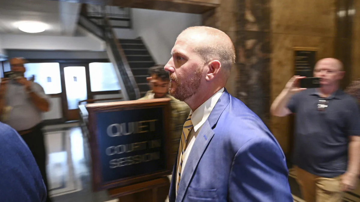 Former Kansas City Chiefs assistant coach Britt Reid walks to a courtroom at the Jackson County Courthouse in Kansas City, Mo., on Sept. 12, 2022. (Chris Ochsner/The Kansas City Star via AP)