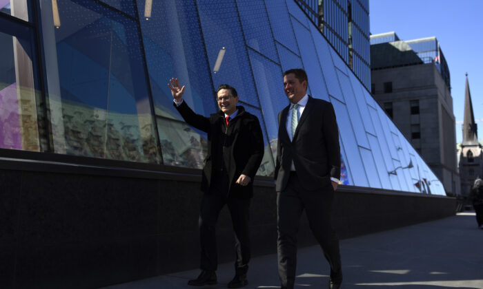 Conservative MP and then-leadership candidate Pierre Poilievre walks with his caucus colleague Andrew Scheer, a former leader of the party, as they arrive for a press conference outside the Bank of Canada in Ottawa, on April 28, 2022. (The Canadian Press/Justin Tang)