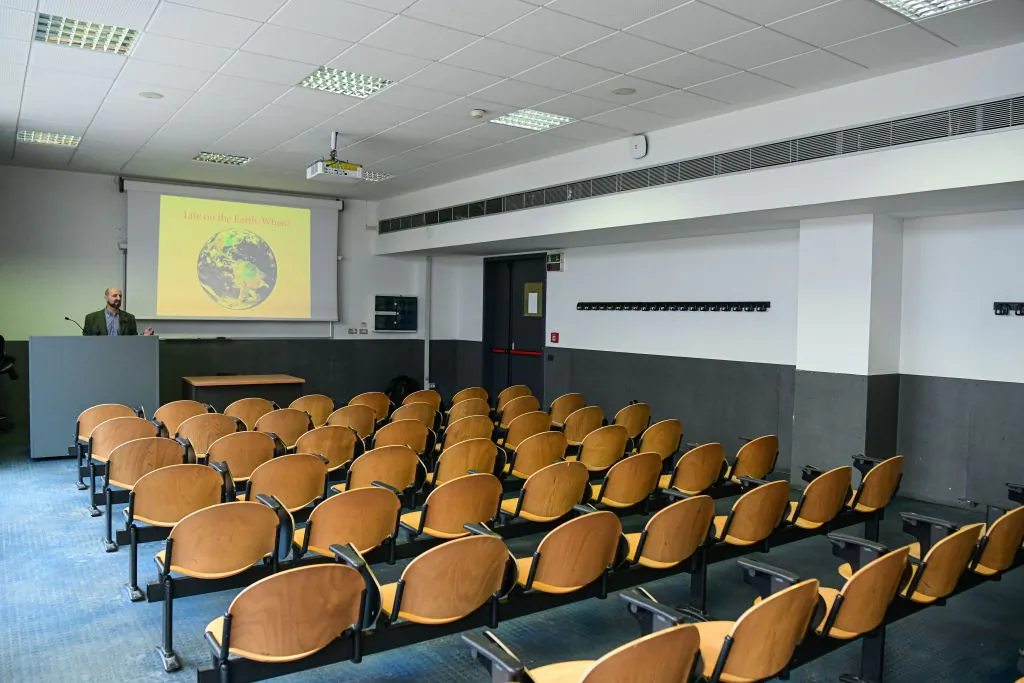 Professor Maurizio Casiraghi of the Department of Biotechnology and Biosciences of Milano Bicocca records a lesson on the evolution of genomes in an empty classroom in Milan, Italy, on March 5, 2020. (Piero Cruciatti/AFP via Getty Images)
