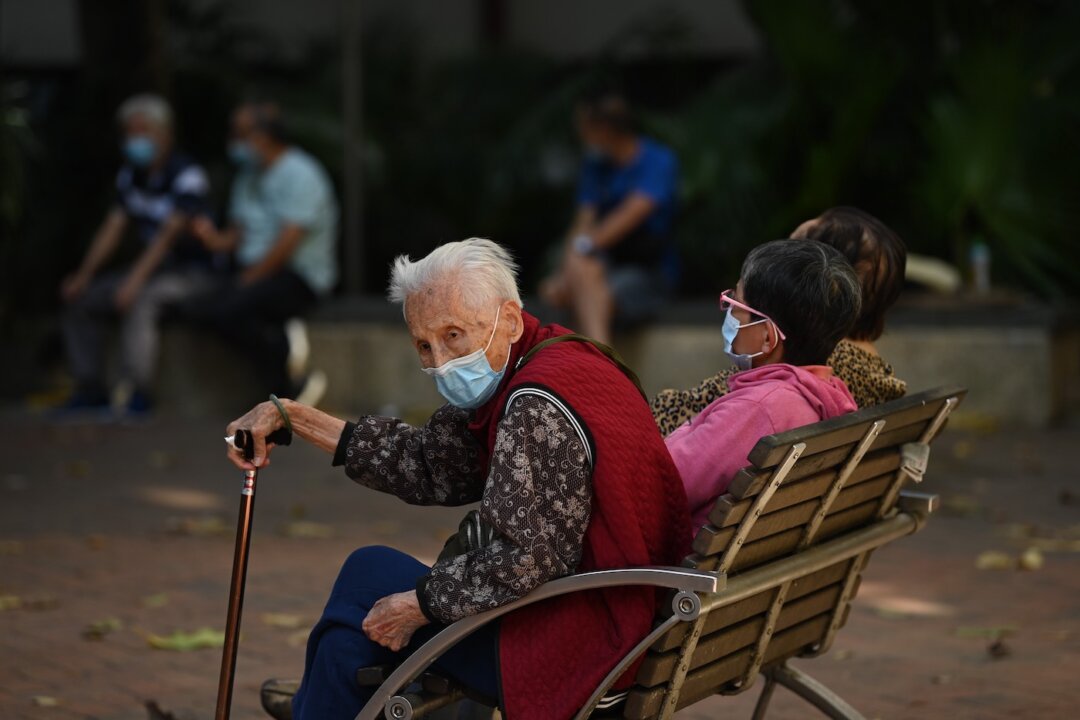 People wait outside a COVID-19 testing center in Hong Kong on Nov. 22, 2020. (Peter Parks/AFP via Getty Images)