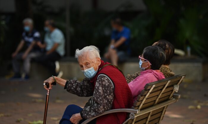 People wait outside a COVID-19 testing center in Hong Kong on Nov. 22, 2020. (Peter Parks/AFP via Getty Images)