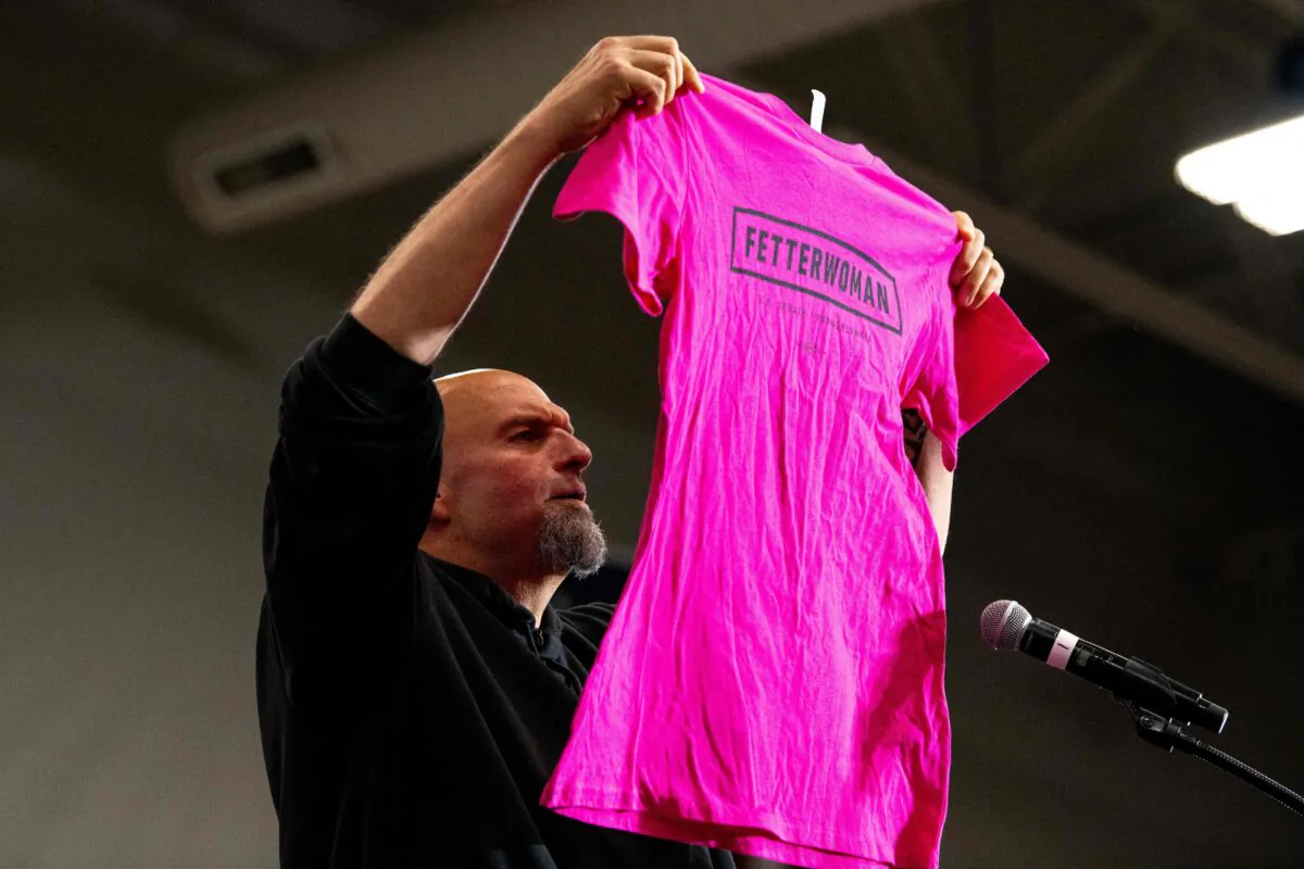 Pennsylvania's Lieutenant Governor and U.S. senatorial candidate John Fetterman holds up a "Fetterwoman" campaign shirt while delivering remarks during a "Women for Fetterman" rally at Montgomery County Community College in Blue Bell, Pa., on Sept. 11, 2022. (Kriston Jae Bethel/AFP via Getty Images)