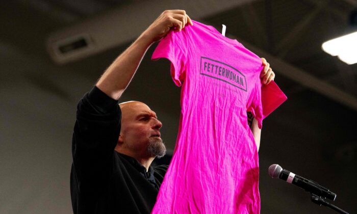 Pennsylvania's Lieutenant Governor and U.S. senatorial candidate John Fetterman holds up a "Fetterwoman" campaign shirt while delivering remarks during a "Women for Fetterman" rally at Montgomery County Community College in Blue Bell, Pa., on Sept. 11, 2022. (Kriston Jae Bethel/AFP via Getty Images)