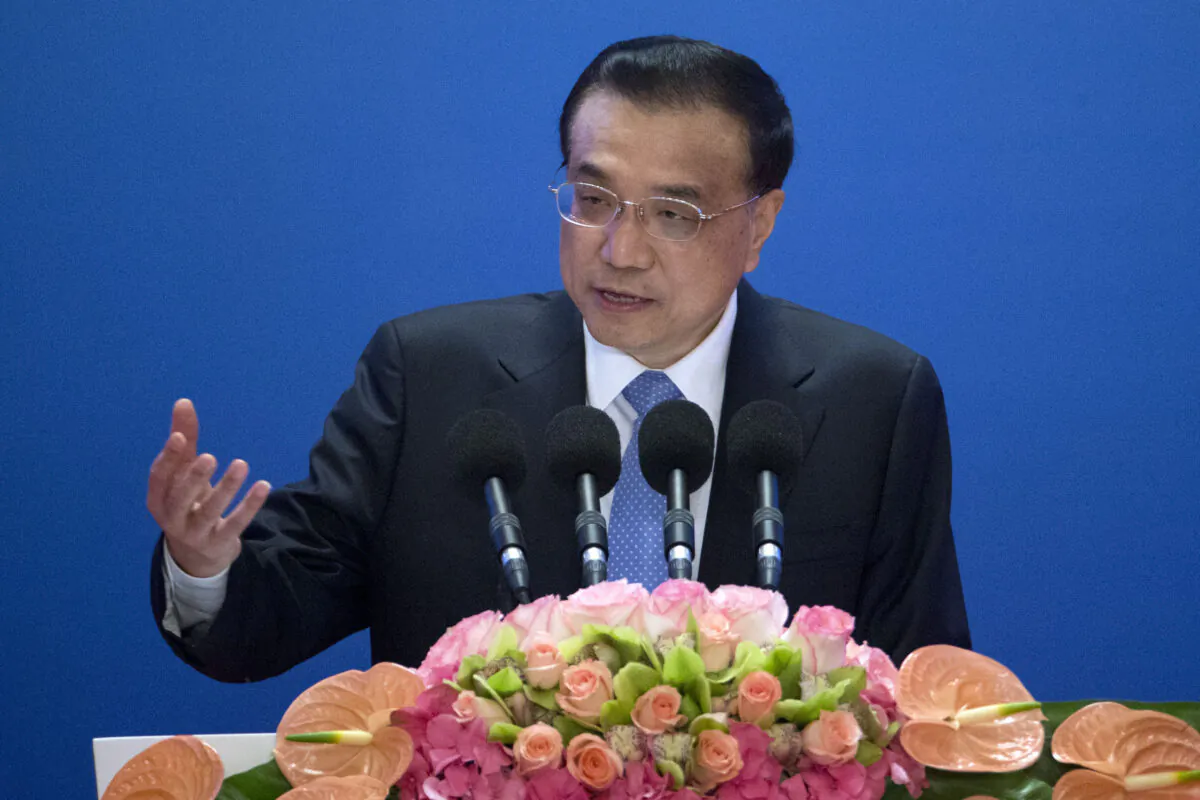 Then-Chinese Premier Li Keqiang speaks as he arrives for the Inaugural Meeting of the Board of Governors of the Asian Infrastructure Investment Bank (AIIB) in Beijing, China on Jan. 16, 2016. (Mark Schiefelbein/Pool/Getty Images)
