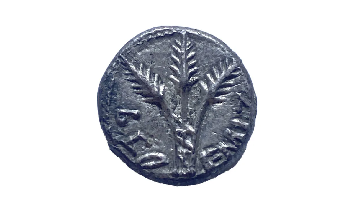 A rare, 2,000-year-old Jewish coin that U.S. authorities have returned to Israel nearly two decades after it was looted, smuggled, and put up for auction in the United States, in a file photo. (Israel's Antiquities Authority via AP)