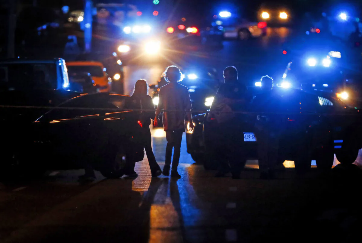 Police officers work at the scene of an active shooter on Poplar Avenue in Memphis, Tenn., on Sept. 7, 2022. (Mark Weber/Daily Memphian via AP)