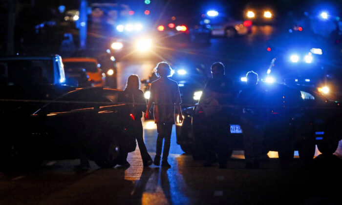 Police officers work at the scene of an active shooter on Poplar Avenue in Memphis, Tenn., on Sept. 7, 2022. (Mark Weber/Daily Memphian via AP)