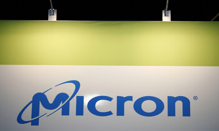 The logo of U.S. memory chip maker MicronTechnology is pictured at their booth at an industrial fair in Frankfurt, Germany, on July 14, 2015. (Kai Pfaffenbach/Reuters)