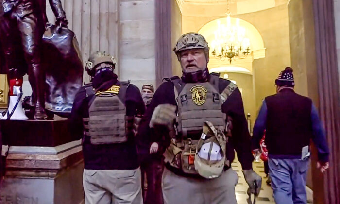 Two Oath Keepers inside the U.S. Capitol on Jan. 6, 2021. The first Oath Keepers criminal trial is scheduled for Sept. 27, 2022. (U.S. DOJ/Screenshot via The Epoch Times)