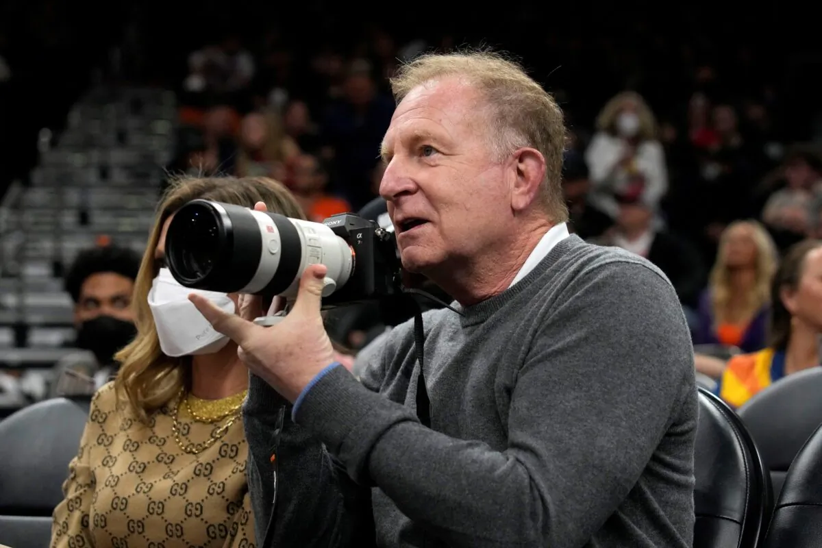 Phoenix Suns owner Robert Sarver takes images during a game against the Houston Rockets at Footprint Center in Phoenix on Feb. 16, 2022. (Rick Scuteri/USA TODAY via Reuters)