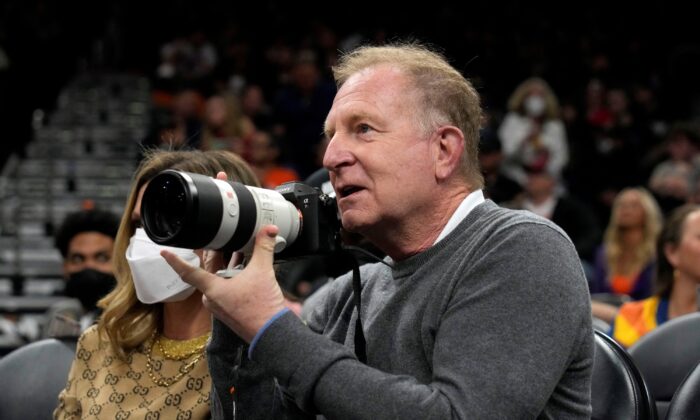 Phoenix Suns owner Robert Sarver takes images during a game against the Houston Rockets at Footprint Center in Phoenix on Feb. 16, 2022. (Rick Scuteri/USA TODAY via Reuters)