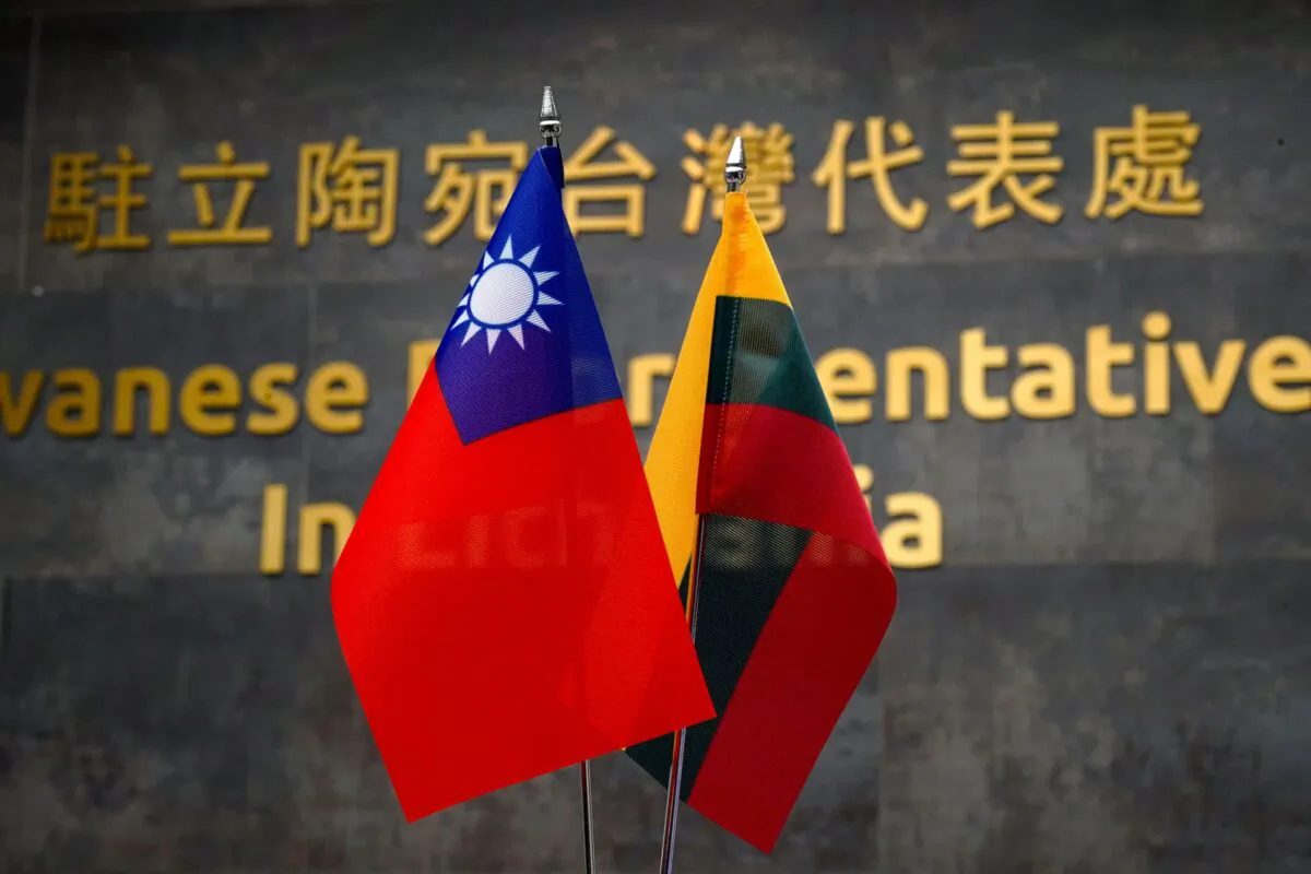 Taiwanese and Lithuanian flags at the Taiwanese Representative Office in Vilnius, Lithuania, on Jan. 20, 2022. (Janis Laizans/Reuters)