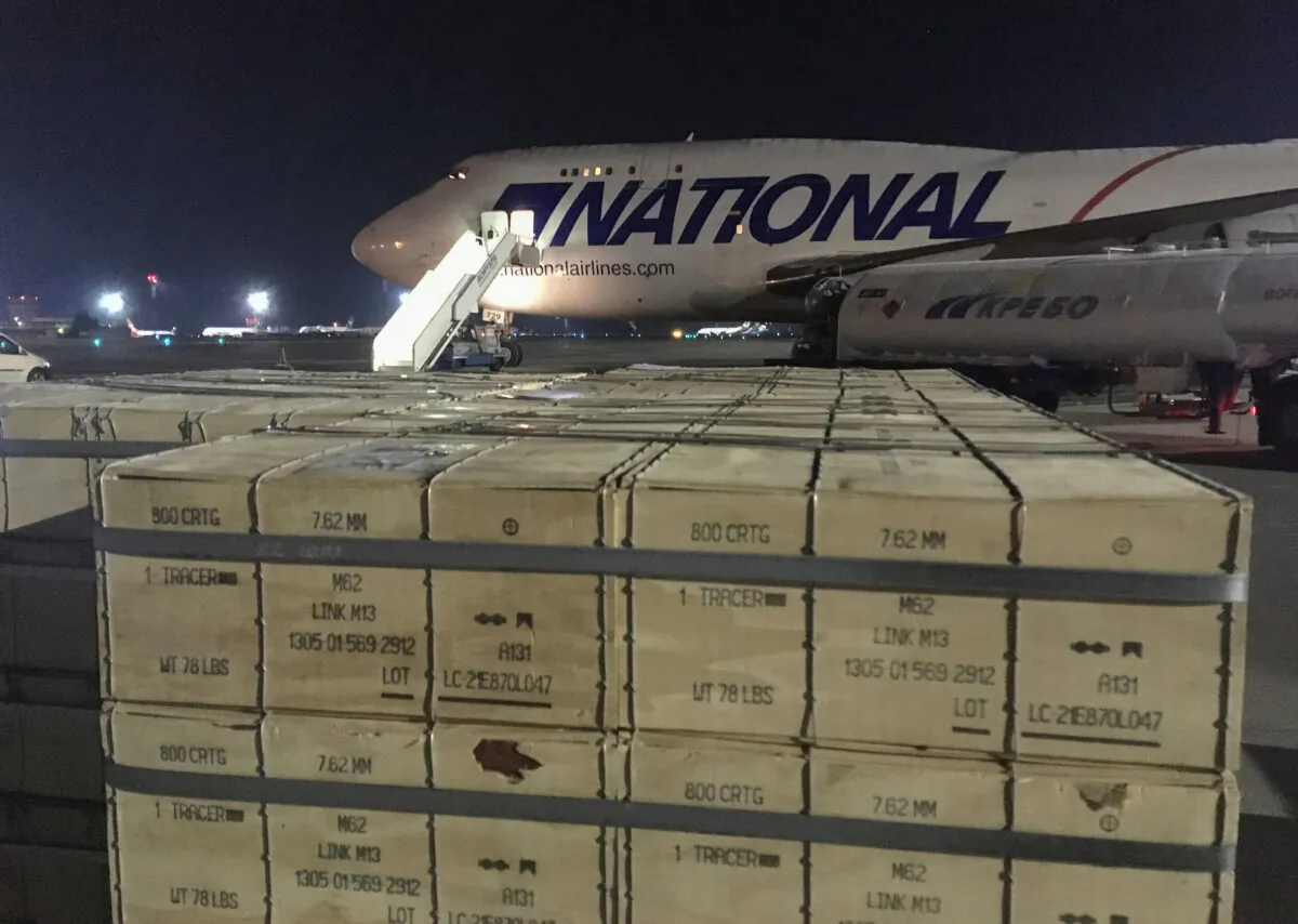 Military aid, delivered as part of the United States' security assistance to Ukraine, is unloaded from a plane at the Boryspil International Airport outside Kyiv, Ukraine, on Feb. 13, 2022. (Serhiy Takhmazov/Reuters)