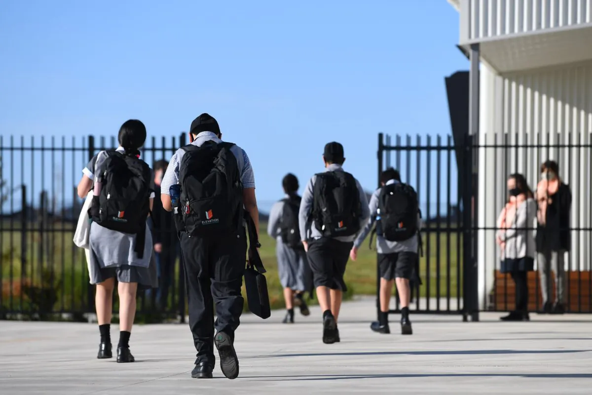 Year seven students arrive to Elevation Secondary College in Craigieburn, Melbourne, Australia, on Oct. 12, 2020. (AAP Image/James Ross) 