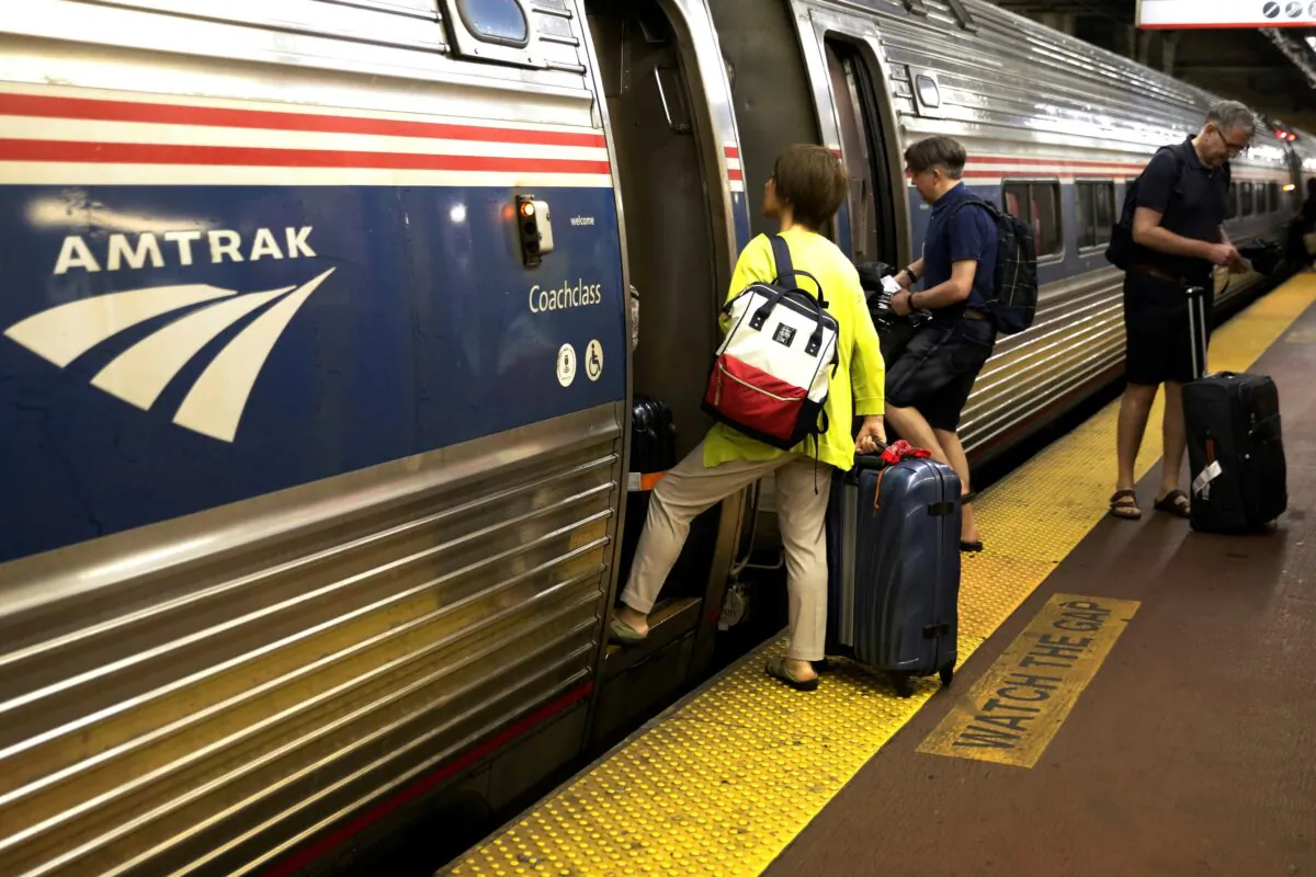 Passengers board an Amtrak train inside New York's Penn Station in New York on July 7, 2017. (Brendan McDermid/Reuters)