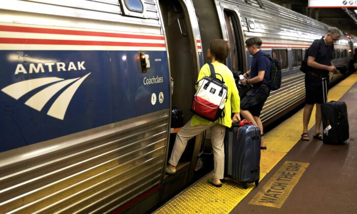 Passengers board an Amtrak train inside New York's Penn Station in New York on July 7, 2017. (Brendan McDermid/Reuters)