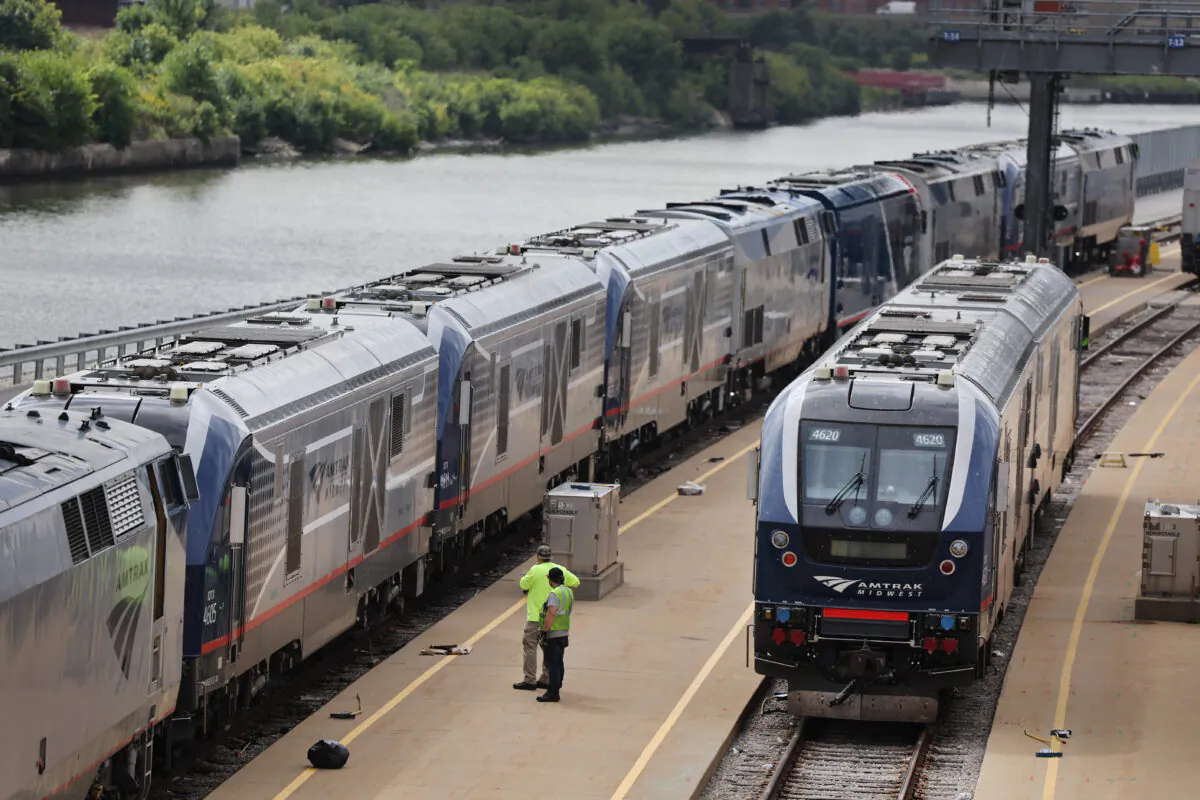 Workers service trains in the Amtrak Car Yard south of the Loop in Chicago, Ill., on Sept. 13, 2022. (Scott Olson/Getty Images)