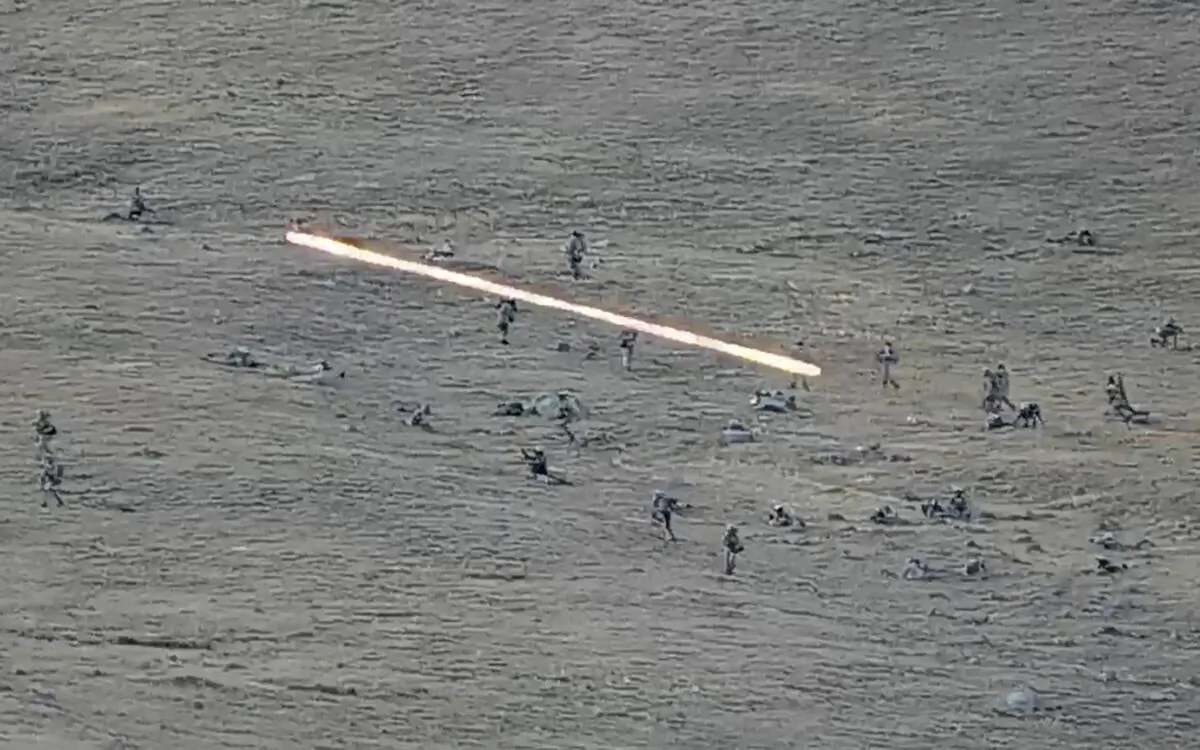 Azerbaijanian servicemen cross the Armenian-Azerbaijani border and approach the Armenian positions in a still from video released on Sept. 13, 2022. (Armenian Defense Ministry via AP)