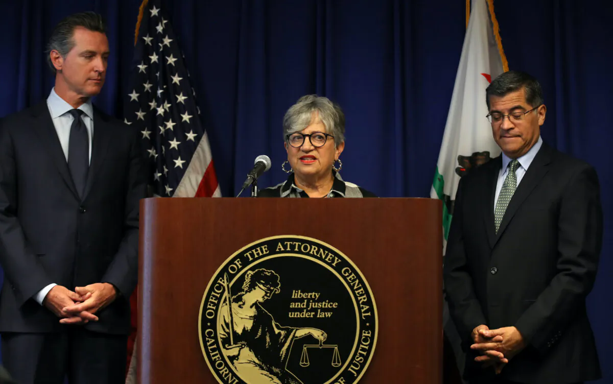 Then-California Air Resources Board Chair Mary Nichols (C) speaks as California attorney general Xavier Becerra (R) and California Gov. Gavin Newsom (L) look on during a news conference in Sacramento on Sept. 18, 2019. (Justin Sullivan/Getty Images)