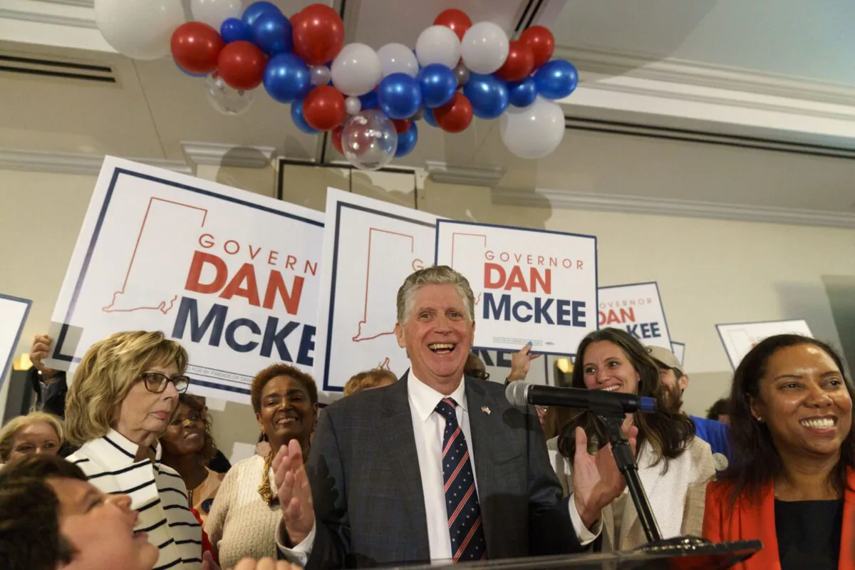 Rhode Island Gov. Dan McKee, joined by Lt. Gov. Sabina Matos (R), gives an acceptance speech in front of supporters at a primary election night watch party in Providence, R.I., on Sept. 13, 2022. (David Goldman/AP Photo)