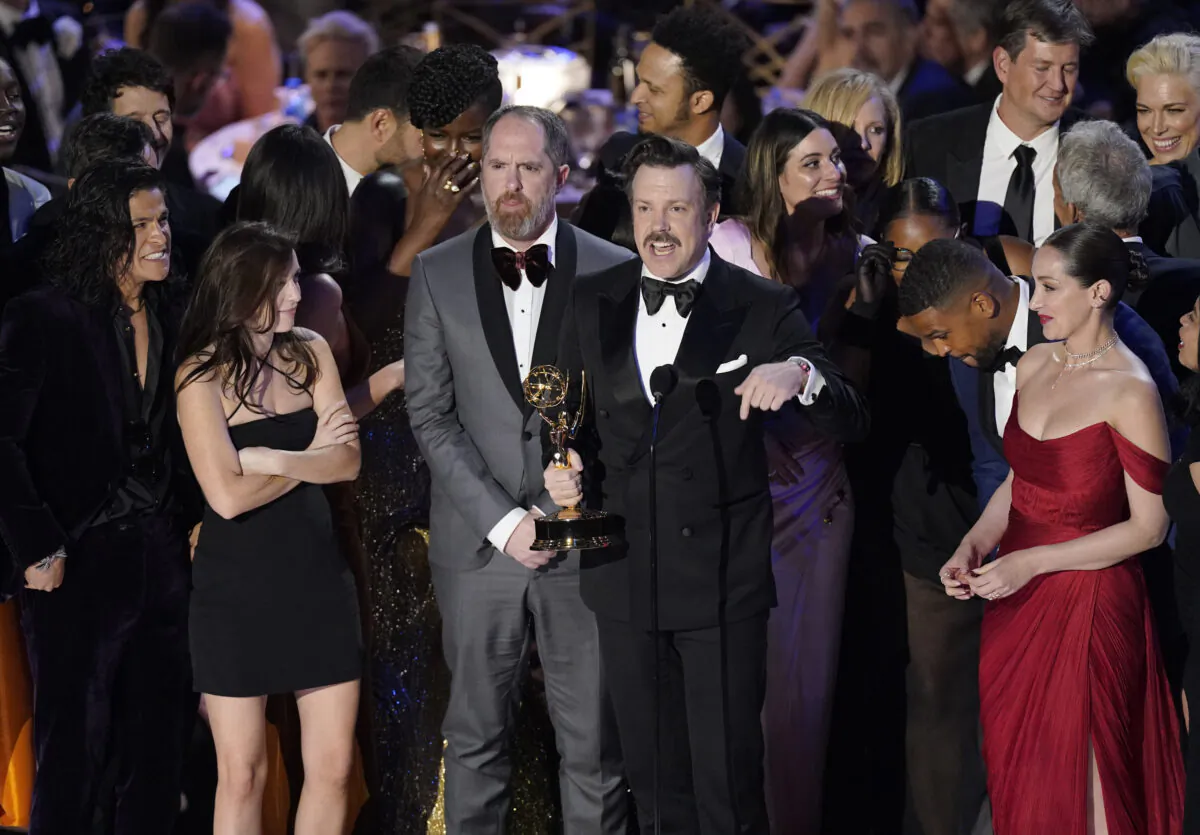 Jason Sudeikis (C) and the cast of "Ted Lasso" accept the Emmy for outstanding comedy series at the 74th Primetime Emmy Awards at the Microsoft Theater in Los Angeles on Sept. 12, 2022. (Mark Terrill/AP Photo)