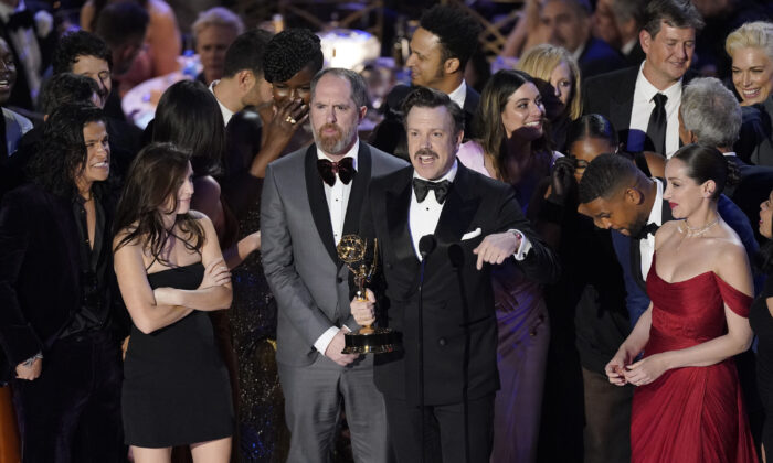 Jason Sudeikis (C) and the cast of "Ted Lasso" accept the Emmy for outstanding comedy series at the 74th Primetime Emmy Awards at the Microsoft Theater in Los Angeles on Sept. 12, 2022. (Mark Terrill/AP Photo)