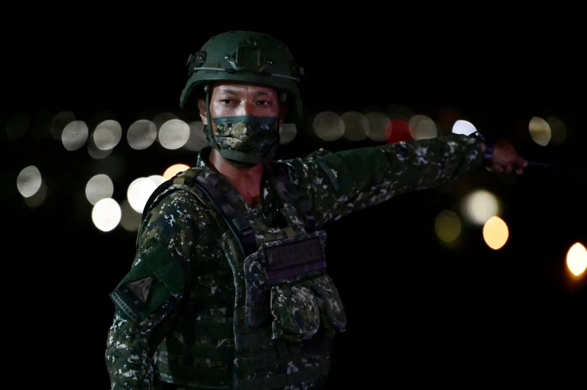 An army member gestures during Taiwan's southern armoured brigade live-fire exercises in Pingtung county, southern Taiwan, on Sept. 6, 2022. (Sam Yeh/AFP via Getty Images)