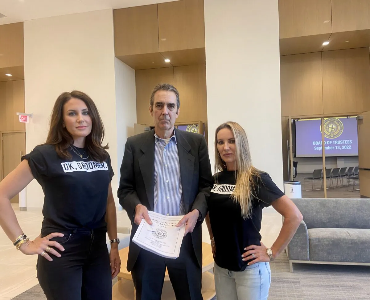 Sarah Feigleson (L), Russell Fish (C), and Rebecca Clark (R) attend a Highland Park school board meeting to protest the sexualization of children in schools Sept. 13, 2022. (Darlene Sanchez/The Epoch Times)
